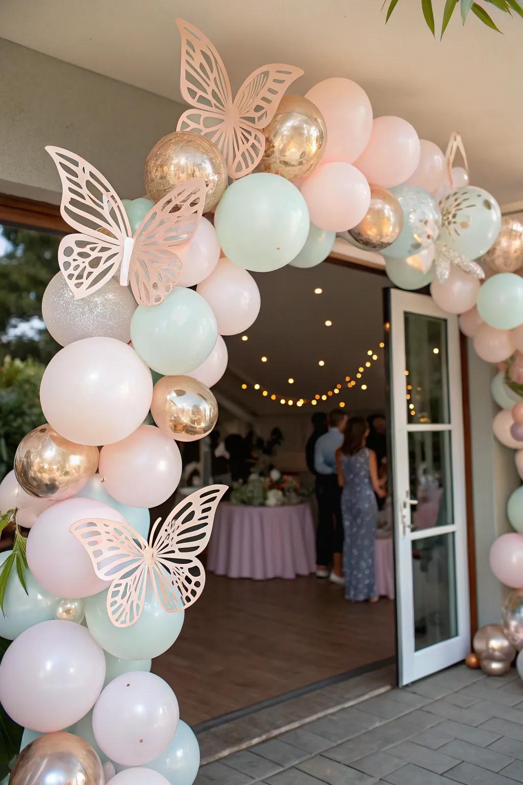 An enchanting balloon garland embellished with butterflies, warmly greeting guests upon their arrival.