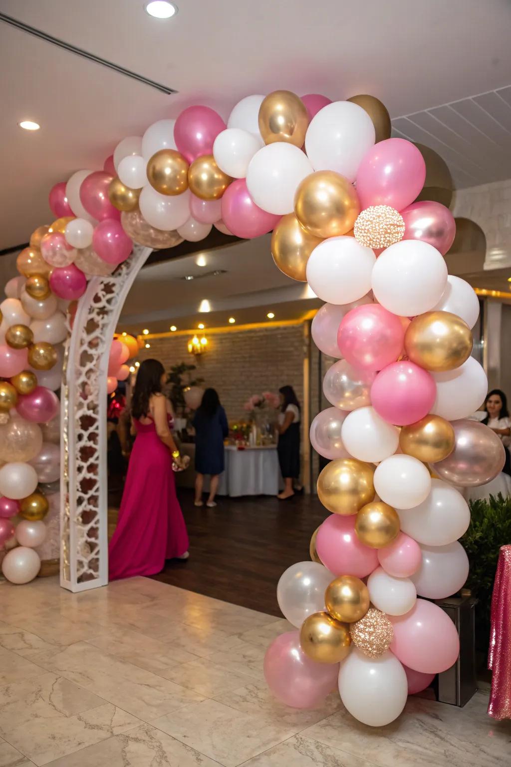 An exquisite balloon arch featuring metallic rose, gold, and alabaster shades.