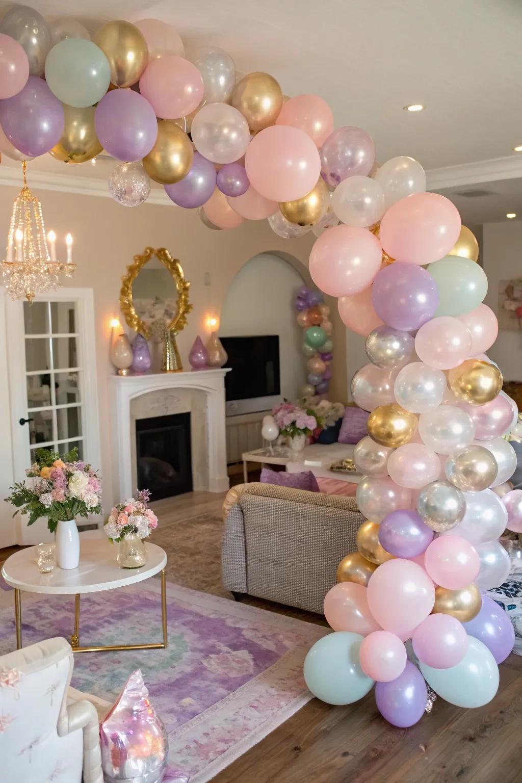 An elegant living space enhanced by a sophisticated balloon arch featuring pastel and glimmer colors.