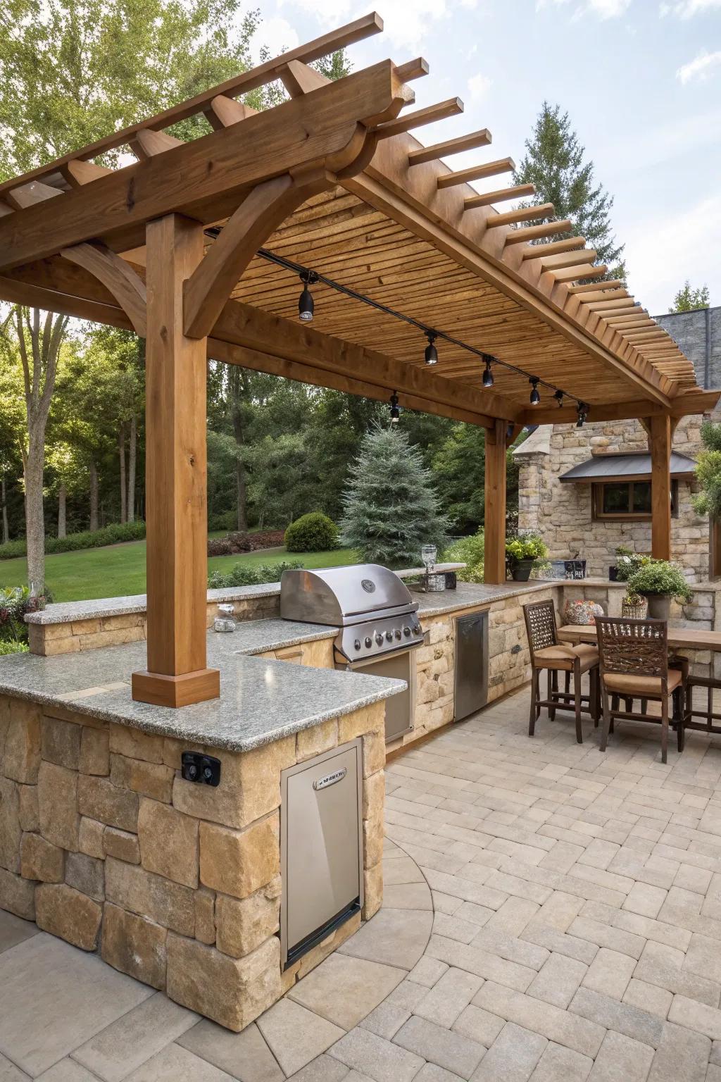 Classic wooden pergola elegantly positioned above a stone-countertop outdoor kitchen.