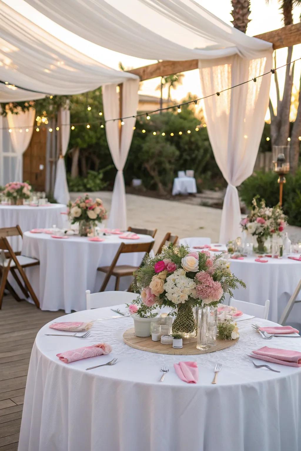 Refined table arrangements that combine simplicity and elegance for an outdoor baptism.