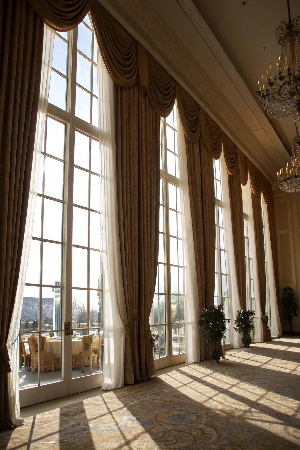 Sophisticated draperies that accentuate the impressiveness of towering windows.