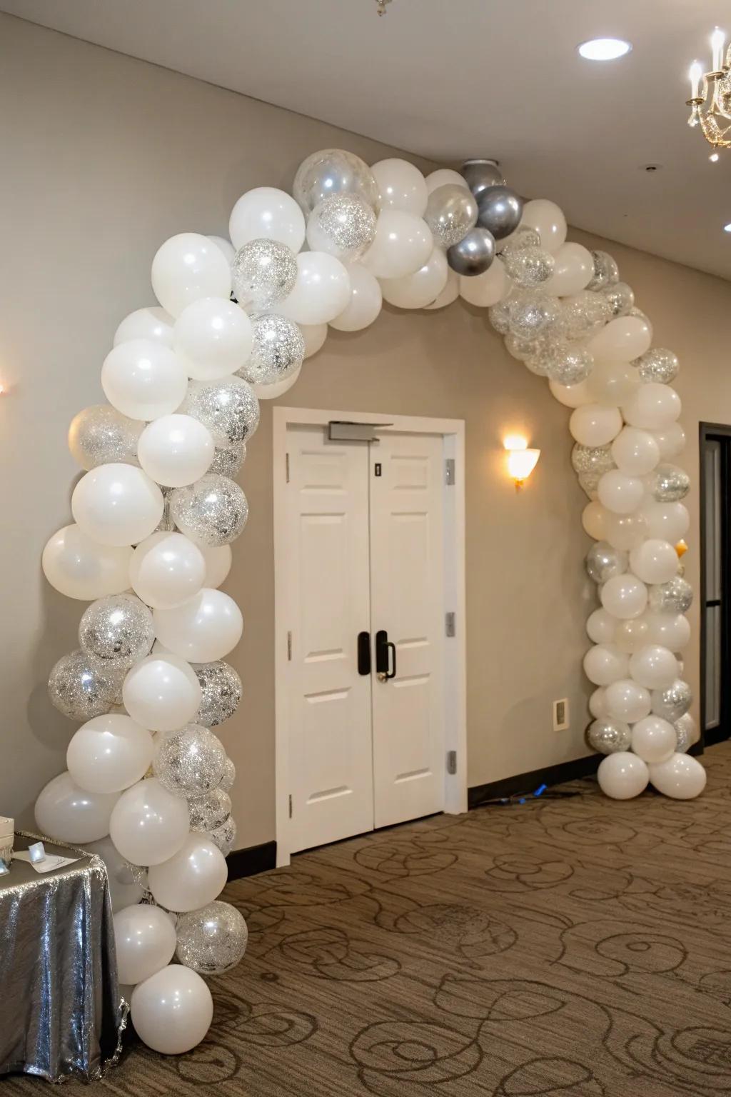 Mark the occasion in high style with a breathtaking white and silver balloon arch.