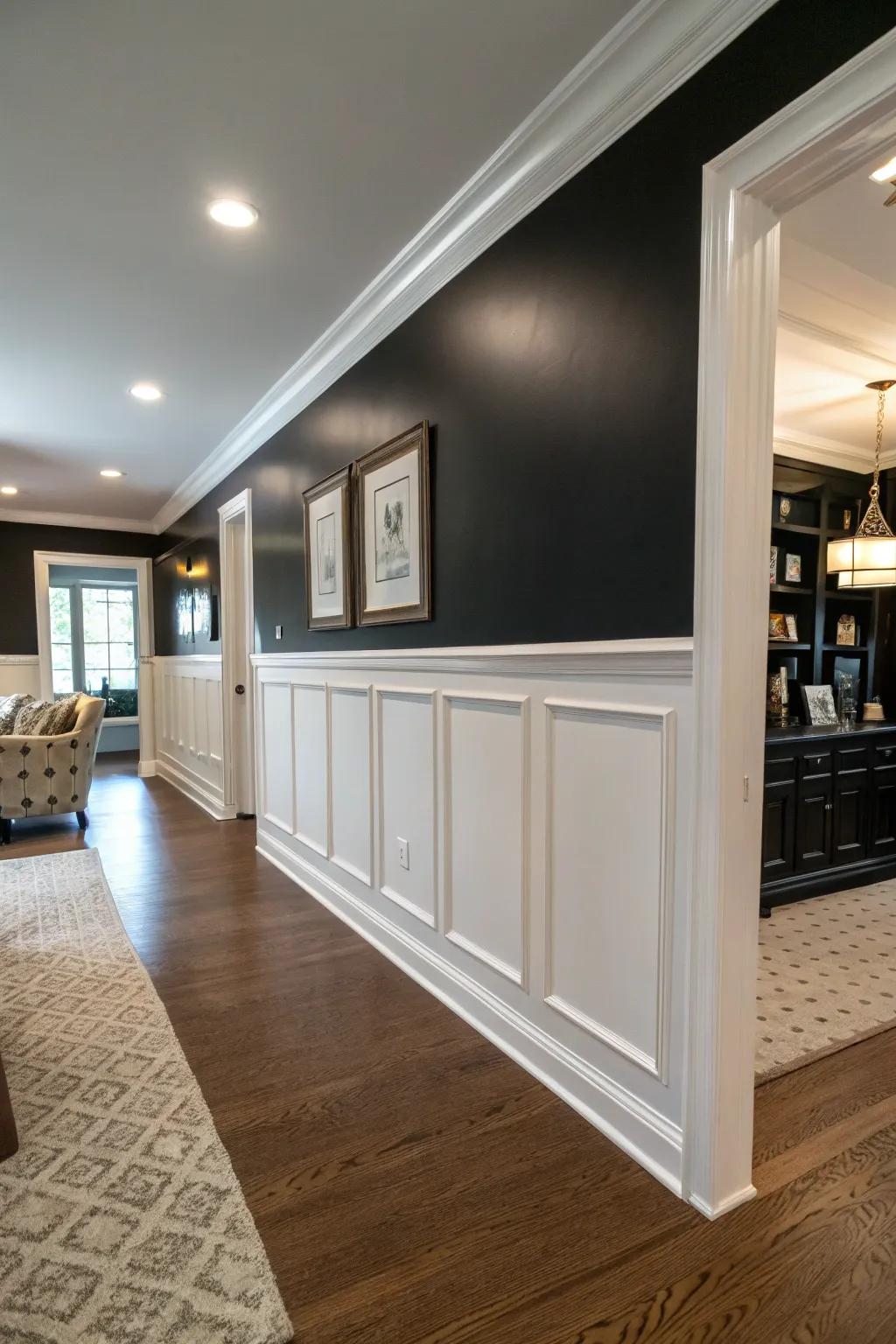 A space featuring a half ebony accent wall paired with alabaster wainscoting for a well-balanced consequence.