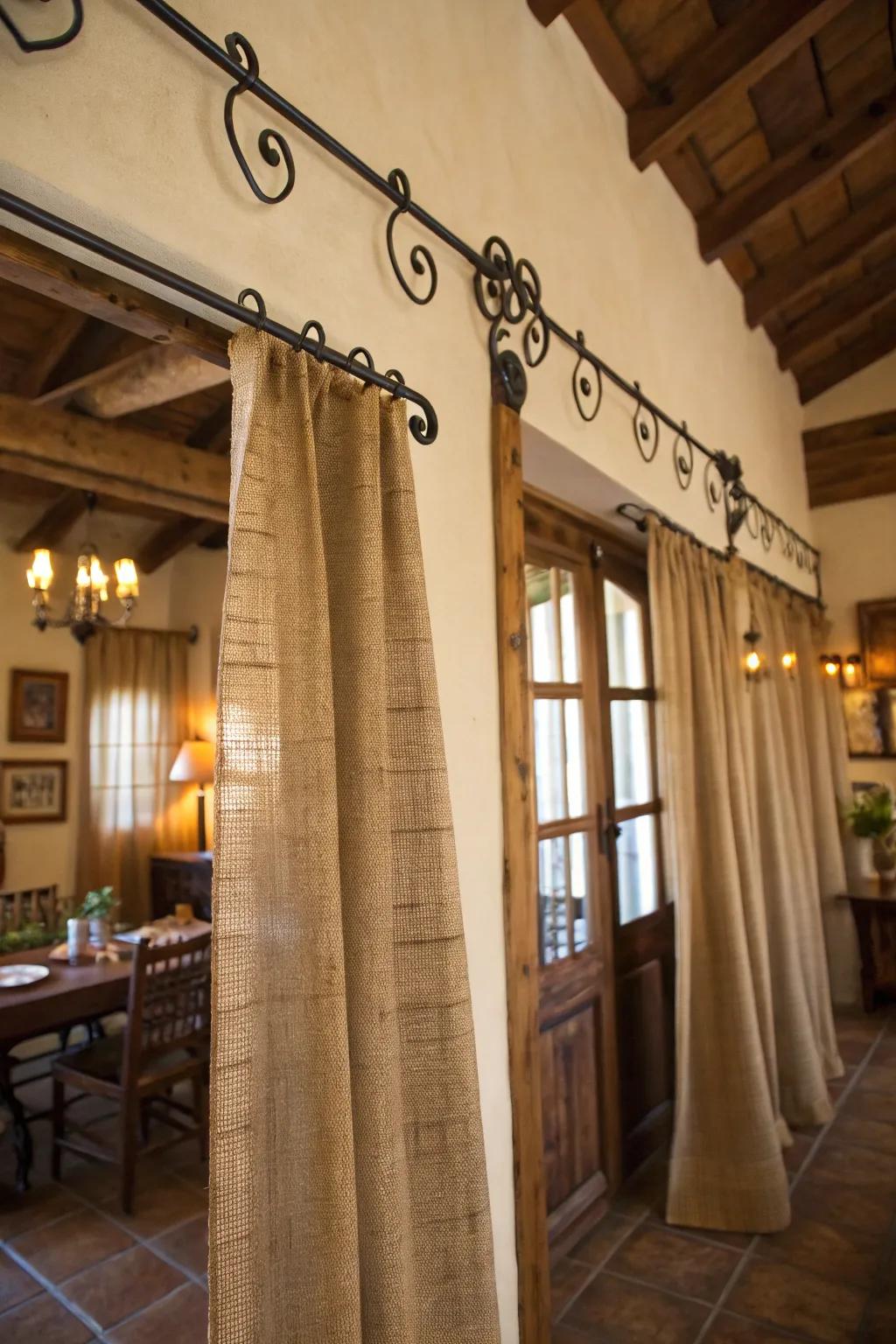 Rustic sophistication with burlap drapes and wrought iron rods.