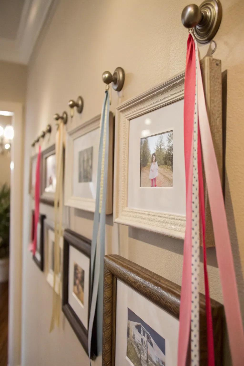 An intriguing wall display featuring frames suspended from knobs using bands.