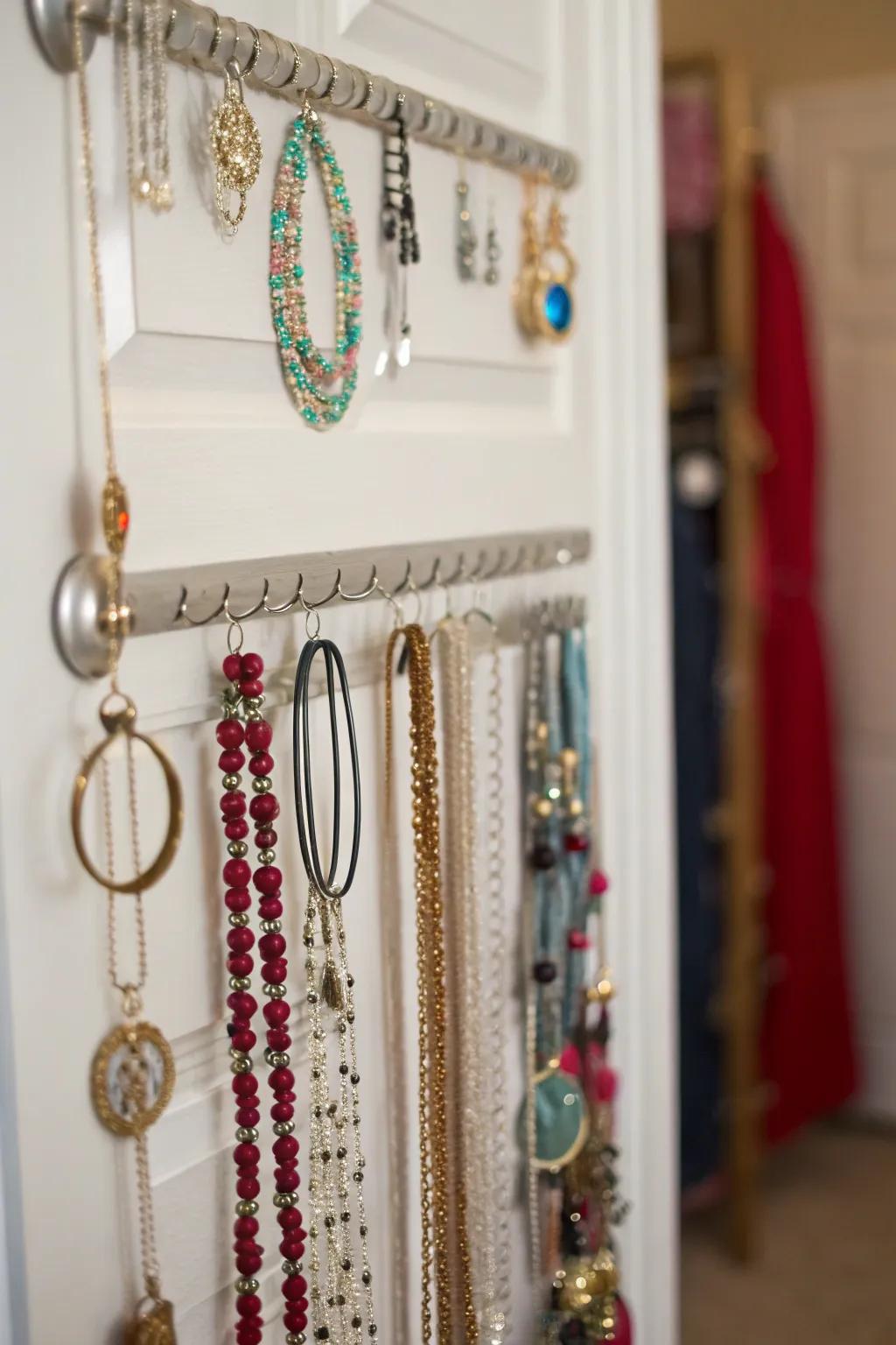 A space-saving jewelry organizer hung over the door