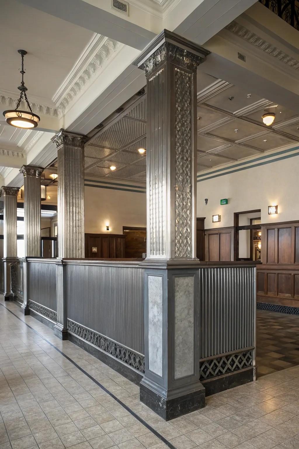 Introduce a singular embellishment through enclosing metallic paneling around pillars.