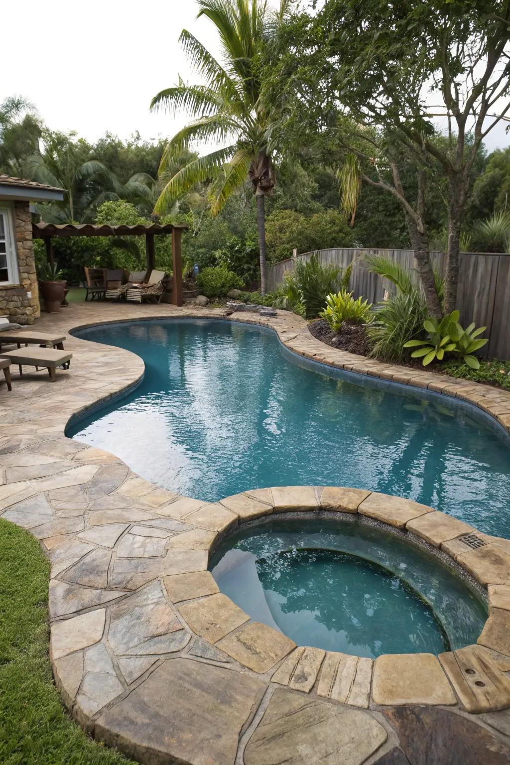 A uniquely shaped pool incorporating individuality to a backyard.