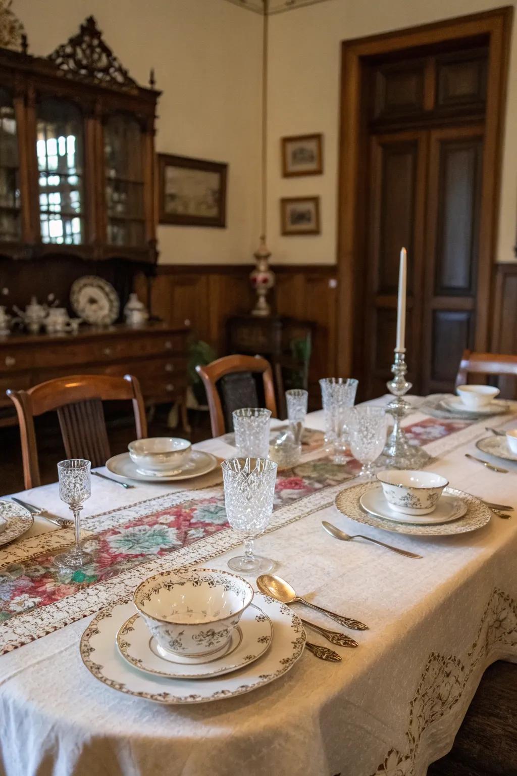 A vintage table arrangement featuring antique tableware and cloths.
