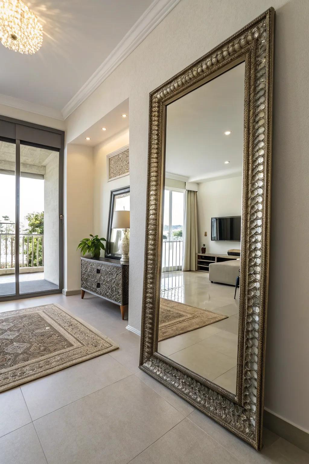A condo with a large decorative mirror reflecting light, creating a spacious feel.