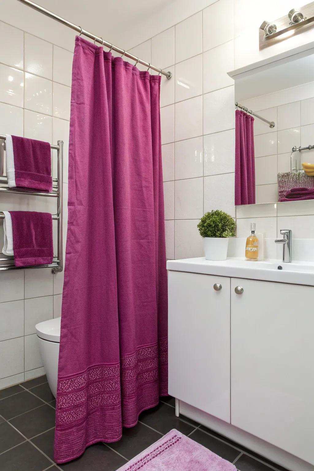 Cerise accents bring a lively touch to this modern bathroom.