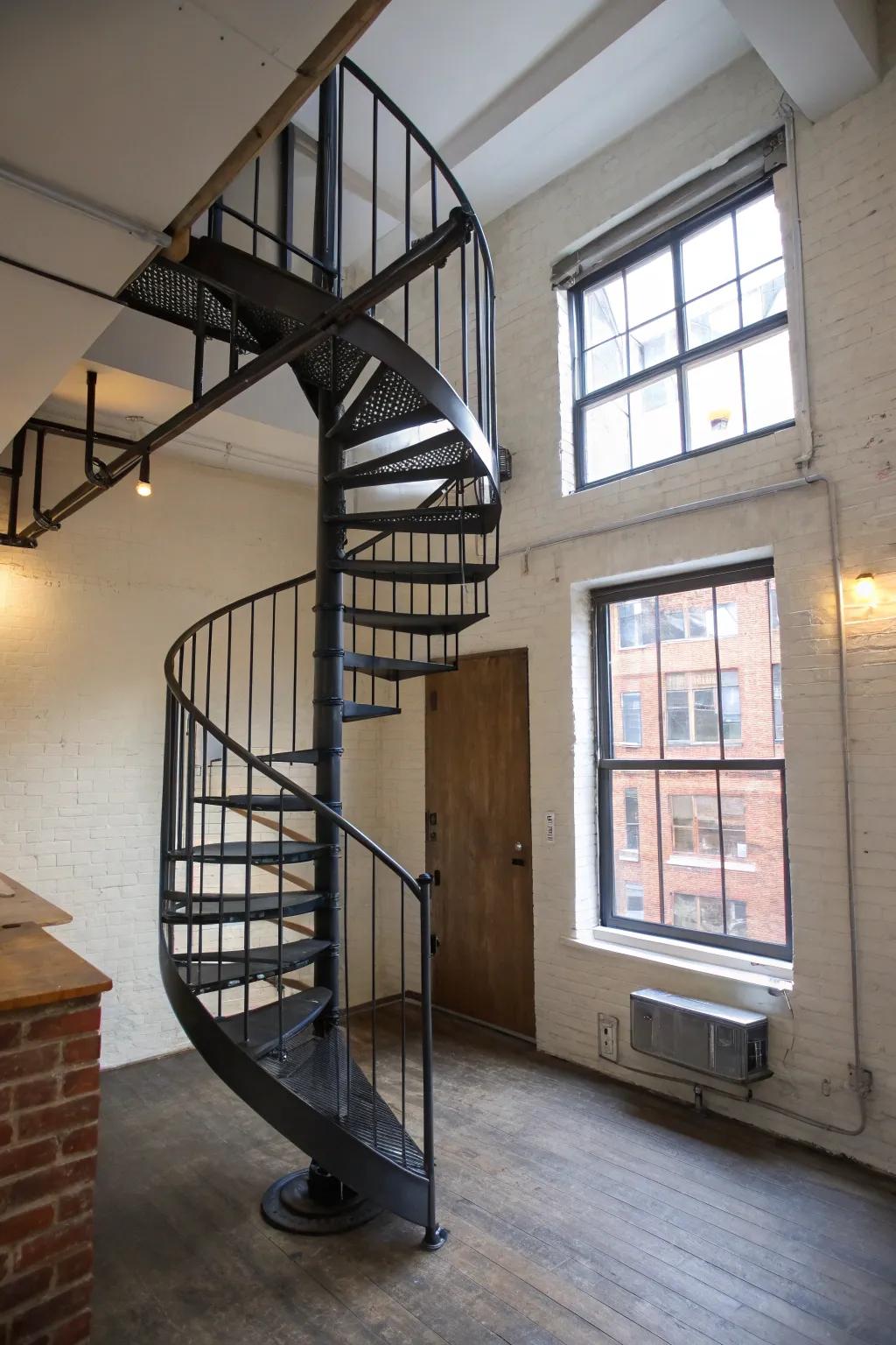 Conserve space gracefully using a small winding stairway.