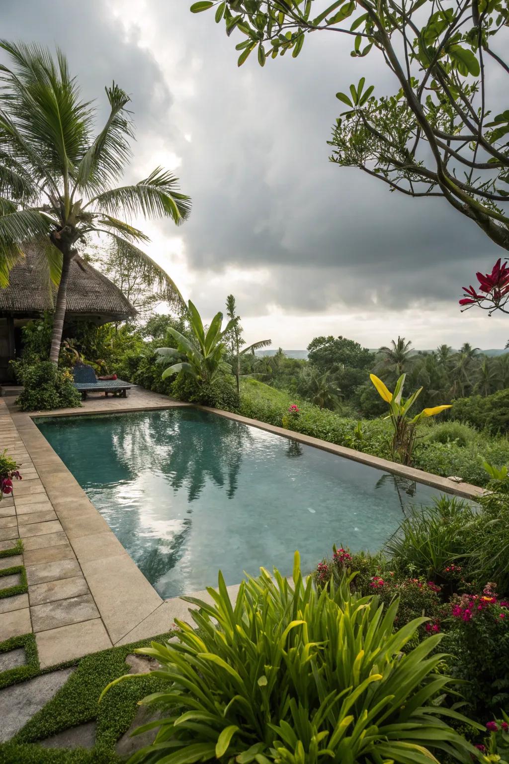 A swimming pool beautifully encompassed by abundant, verdant verdure.