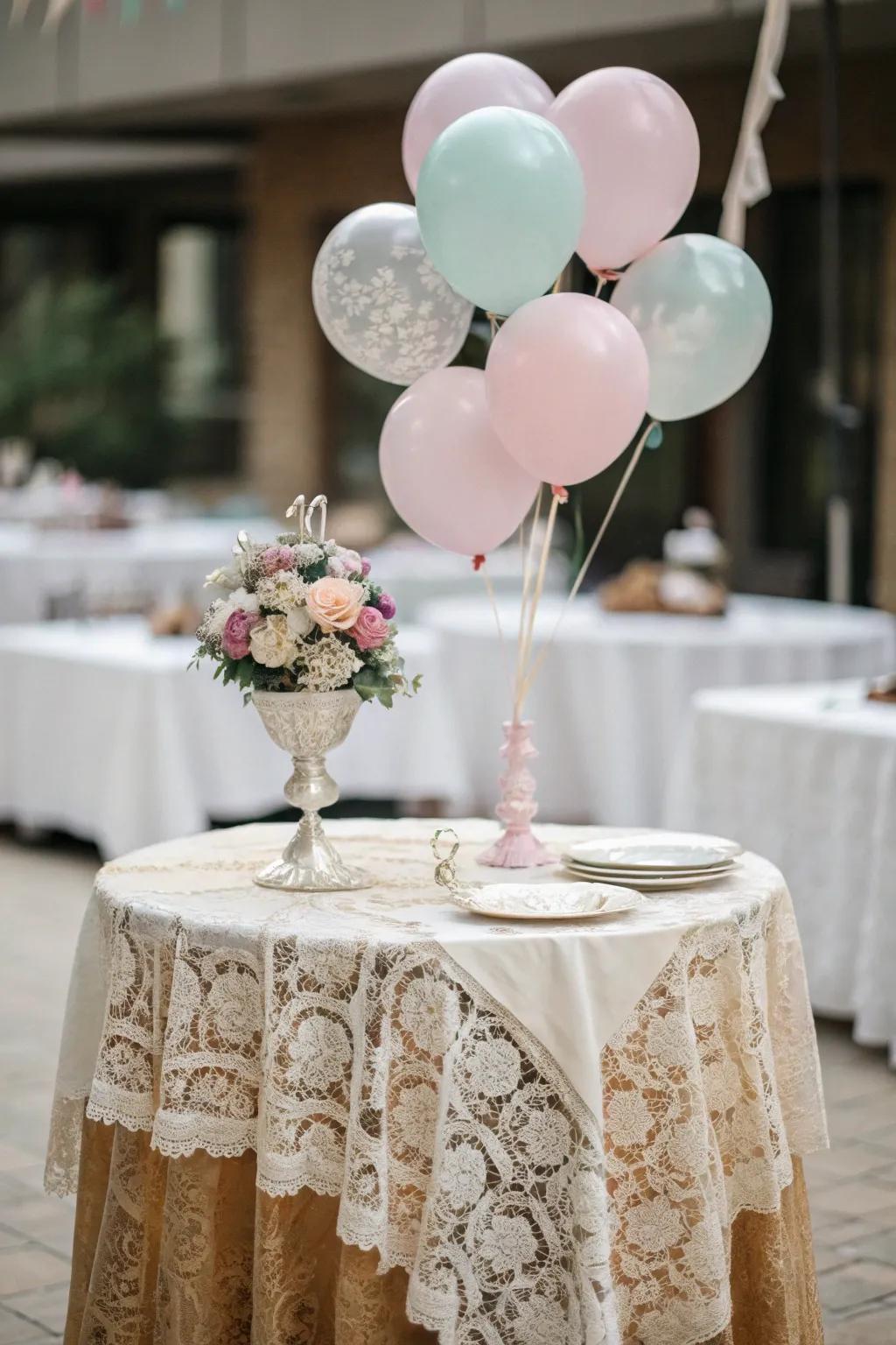 Lace and soft balloons convey vintage refinement.