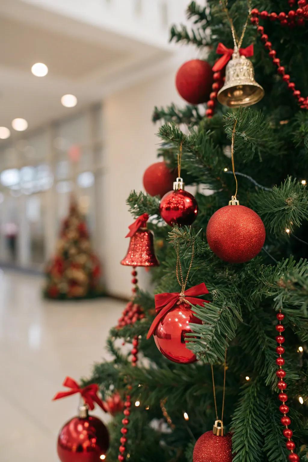 Festive Christmas tree showcasing scarlet baubles and jingle bells