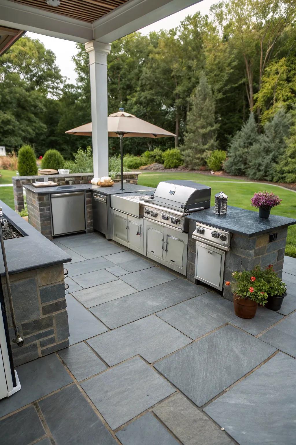 A slate patio featuring a stylish and functional outdoor kitchen.