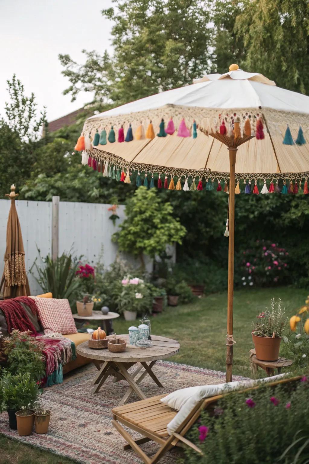 A bohemian backyard with a tassel-adorned umbrella.