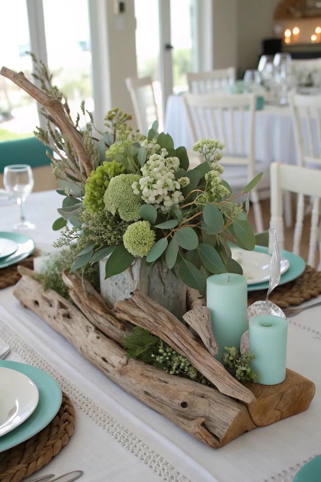 A coastal-inspired centerpiece featuring driftwood and verdant hues for a relaxed ambiance.