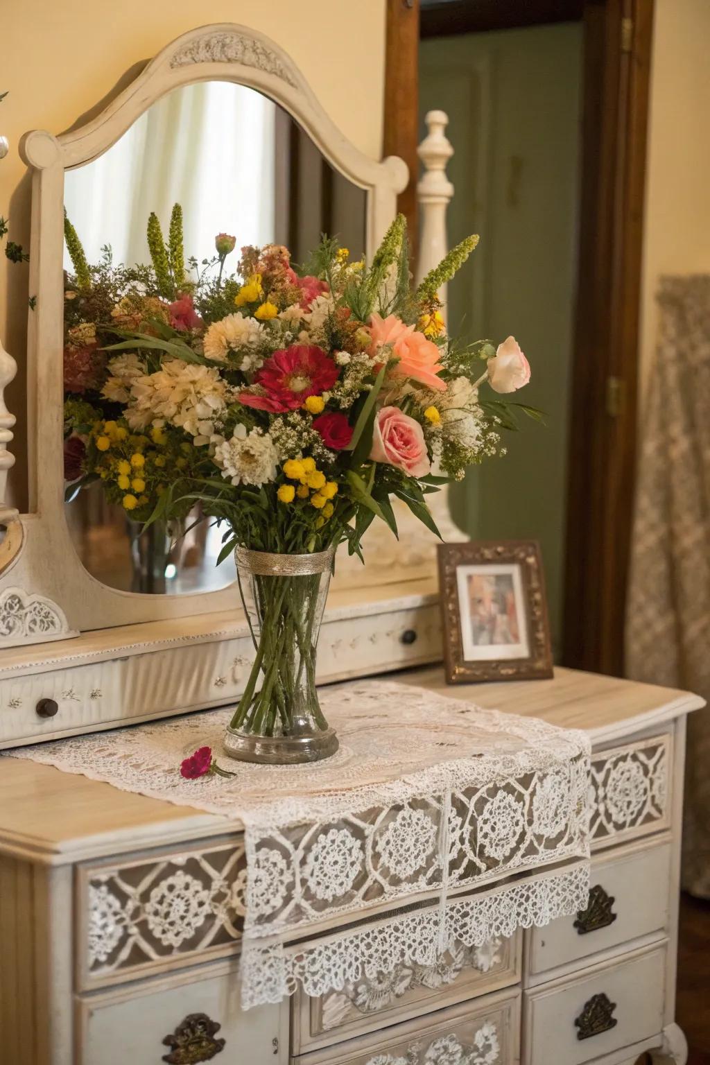 Fresh blooms contribute a vibrant and natural trace onto antique dressing tables.