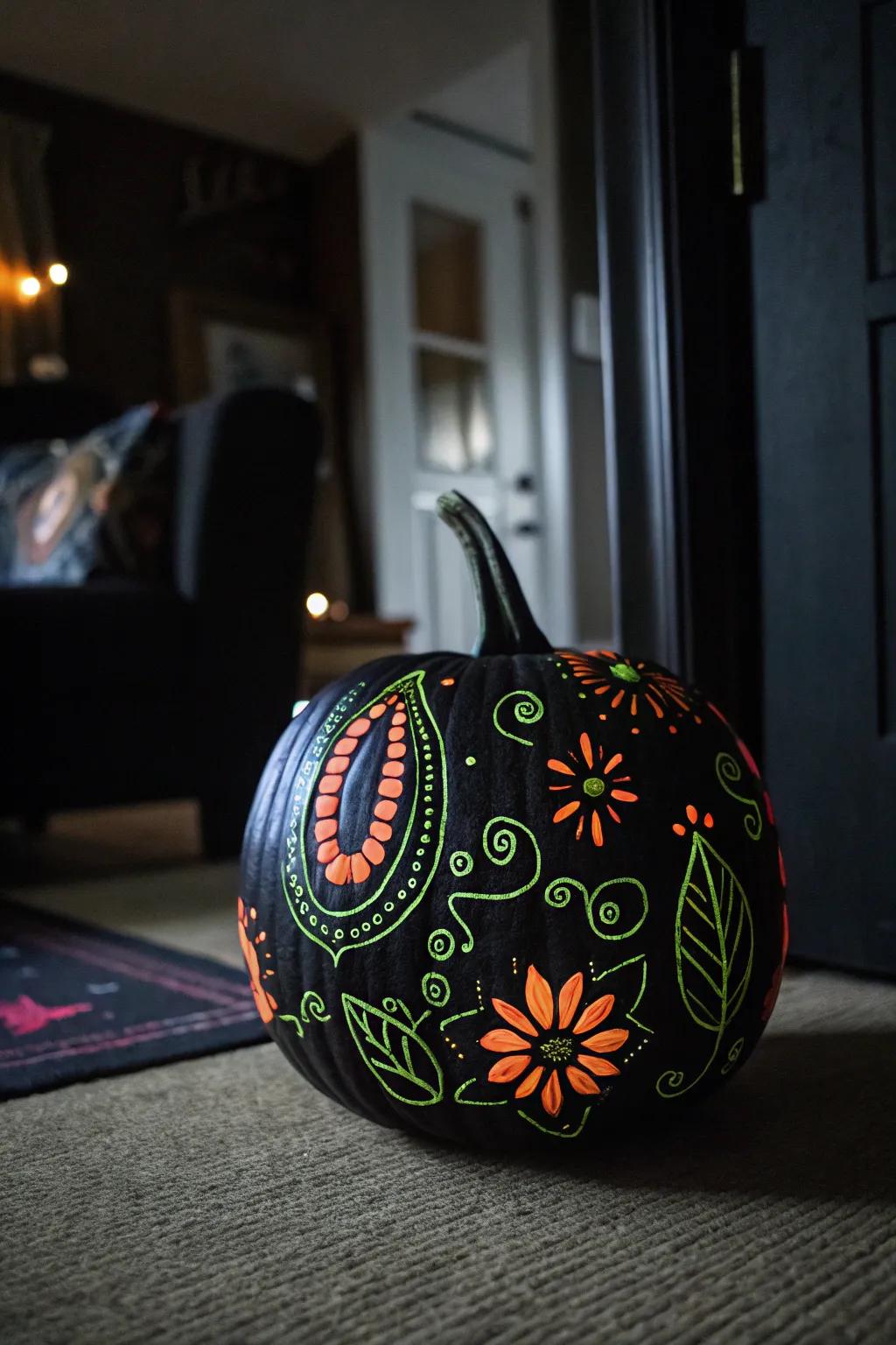 A dark-hued pumpkin with photoluminescent designs, appending a bewitching touch to nighttime decoration.