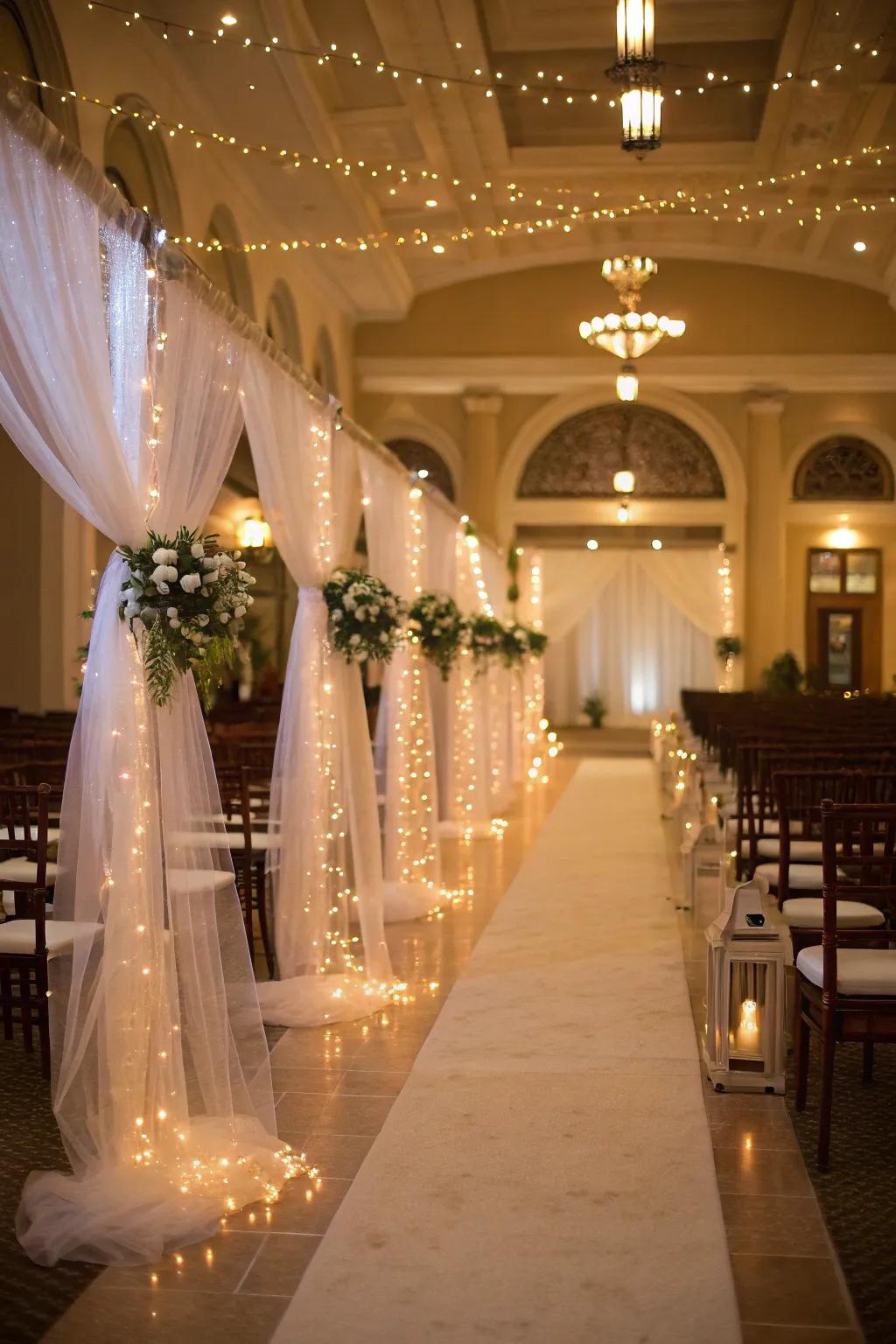 Tulle and fairy lights coalesce to create a dreamlike and radiant aisle.