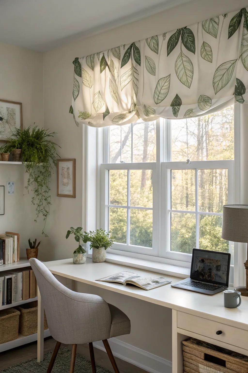 A window exhibiting a nature-inspired valance within a tranquil home office.