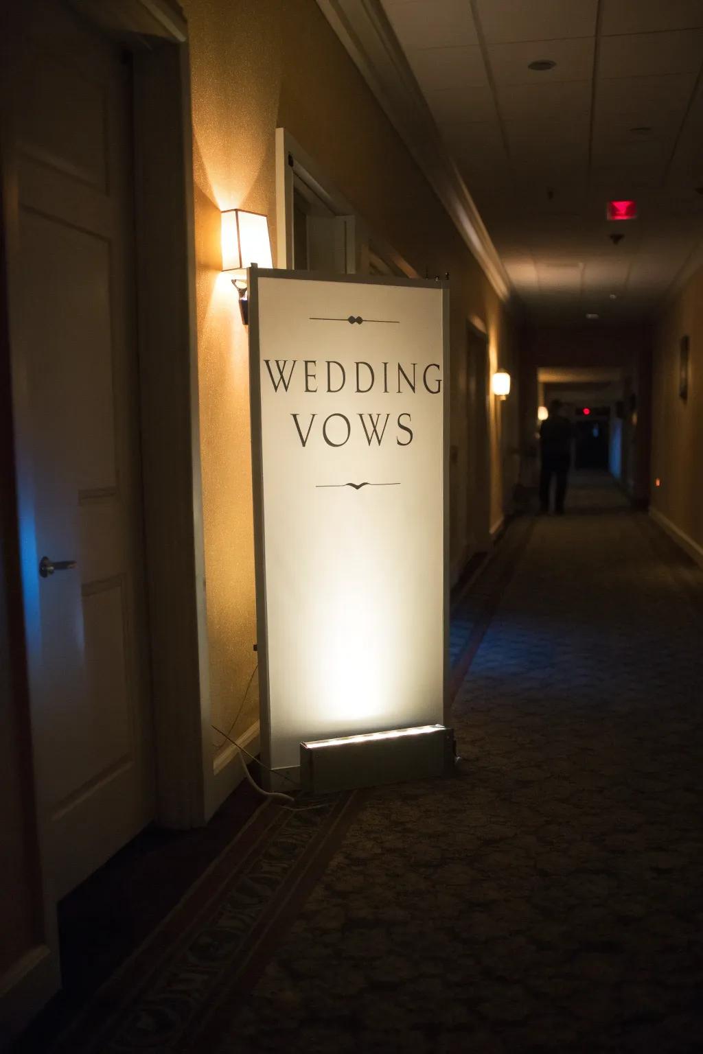 Glowing illuminated receptacle showcasing vows, injecting warmth into a hallway.
