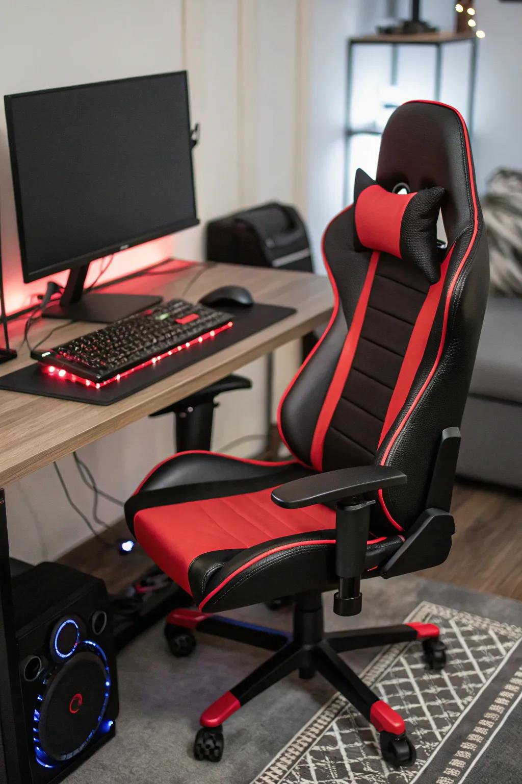 A sophisticated charcoal and scarlet ergonomic chair is prepared for use in a gaming setting.