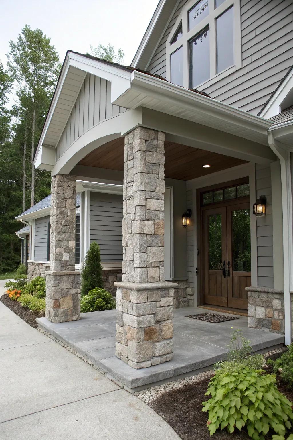 An imposing entrance featuring grey undertones and rock columns.