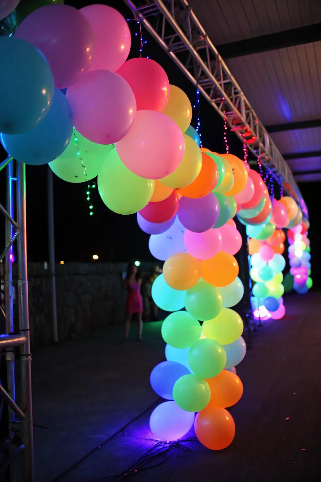A spirited neon balloon arrangement aglow under blacklight, ideal as a celebratory backdrop.