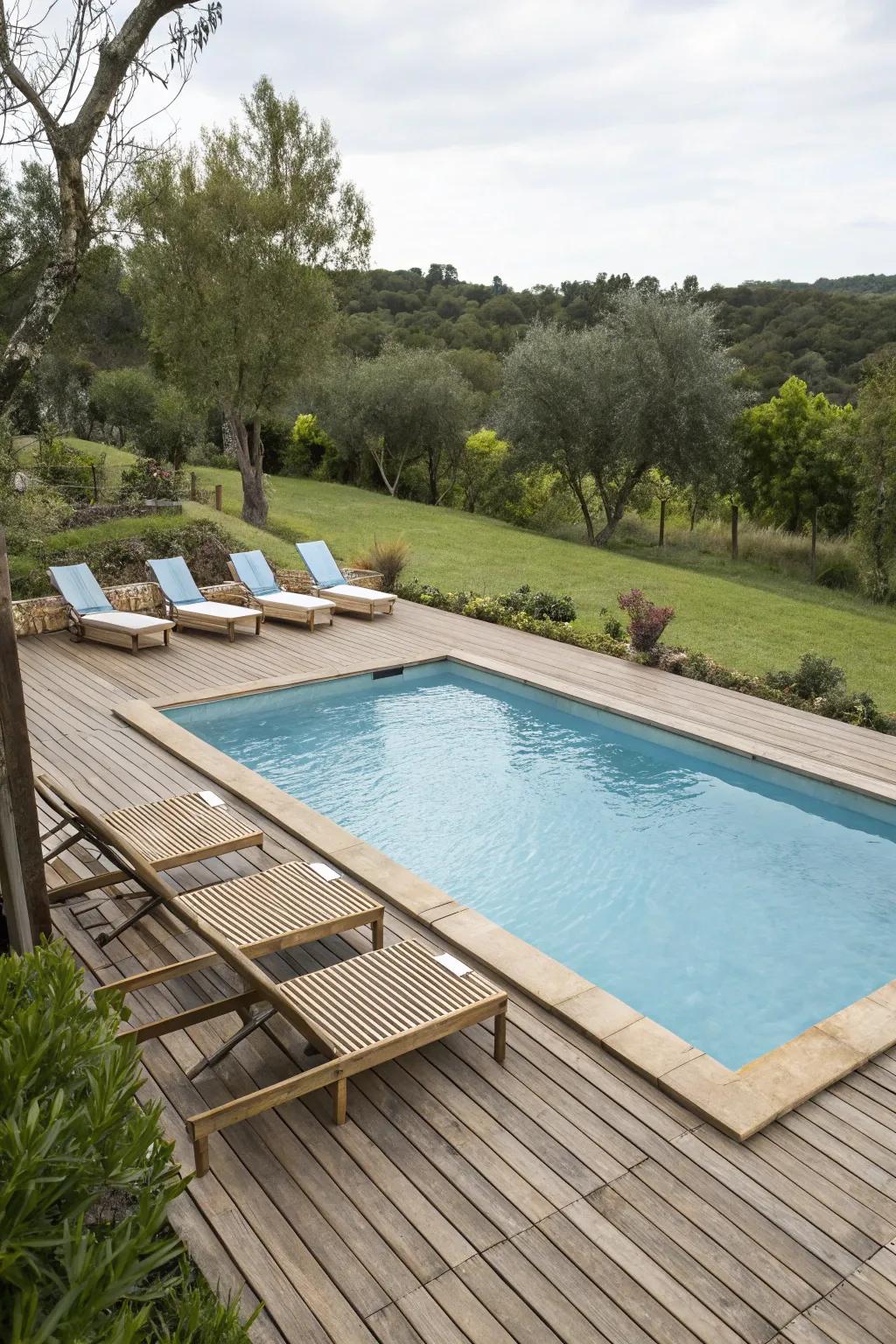 Wooden decking adds warmth and a natural feel to the poolside.