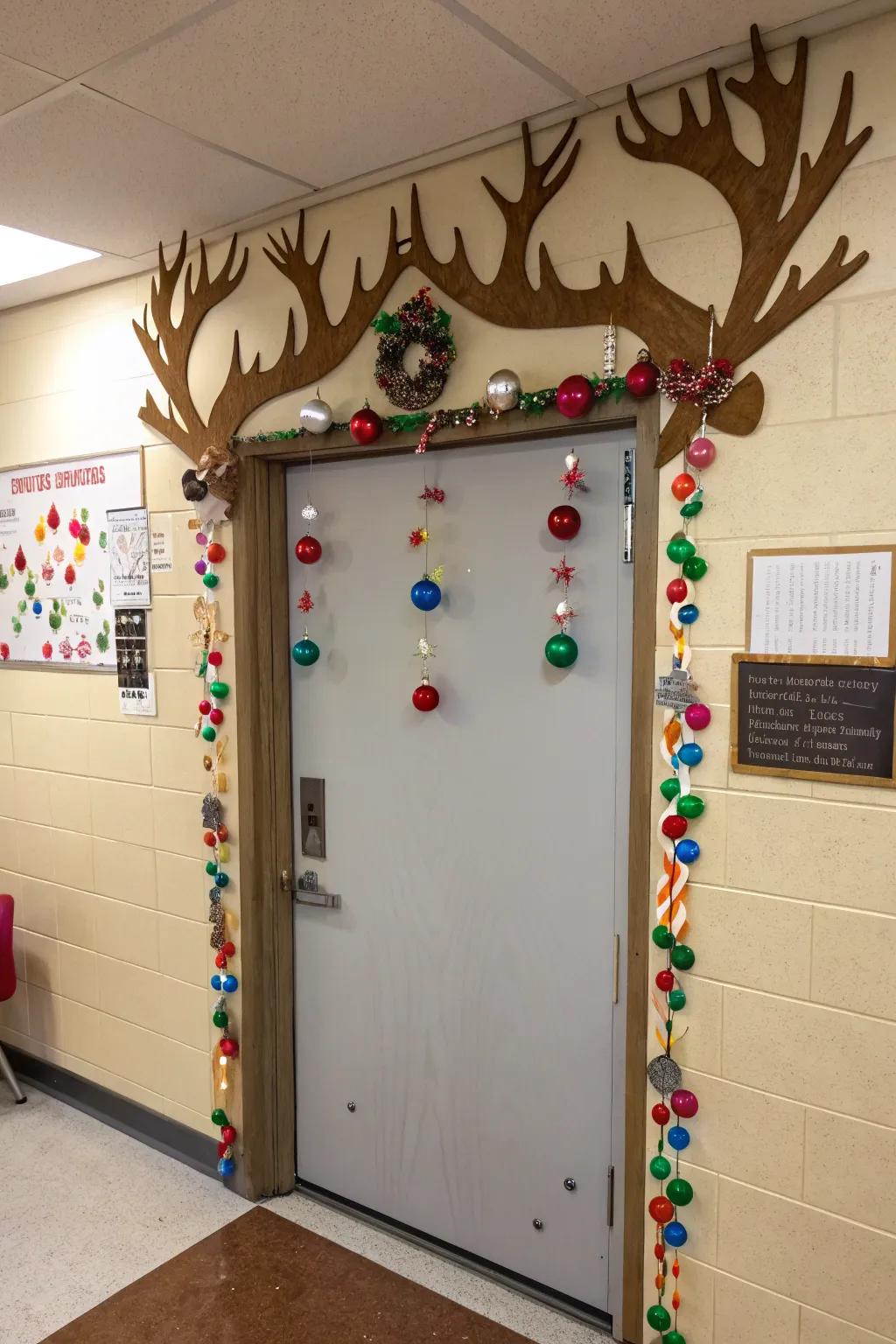 A classroom door exhibiting grand reindeer antlers, embellished with student-made ornaments.