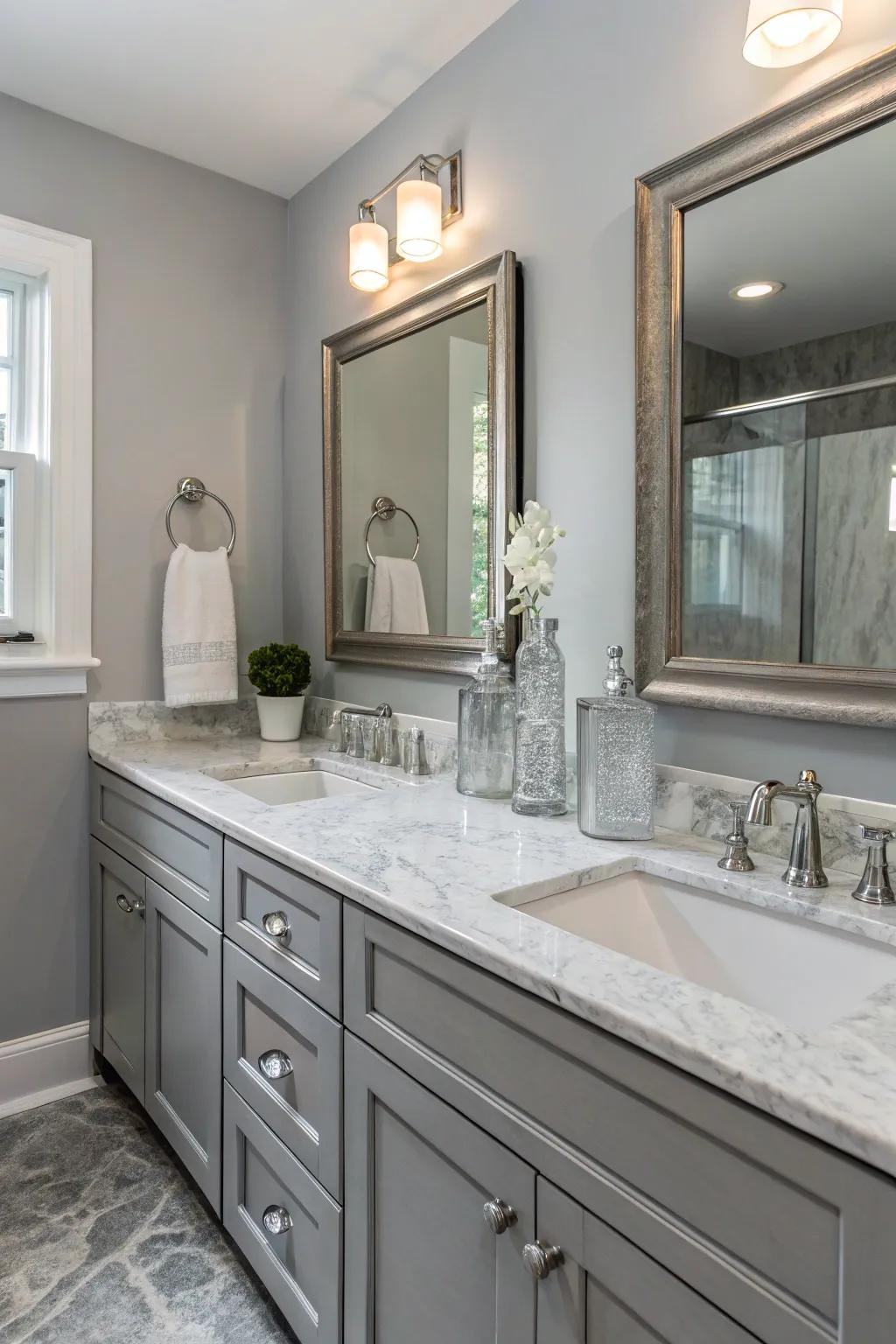 Marble and glass elements enhance the luxury of the grey bathroom.