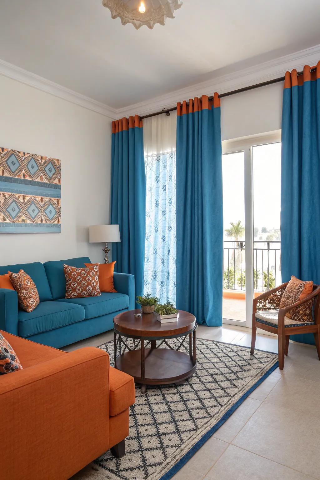 Striking tangerine embellishments engender a spirited dichotomy against the serene azure window coverings, enlivening the room.