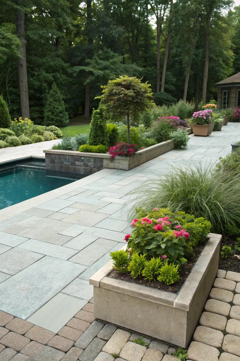 Integrated vegetation with pavers provides a smooth transition to the yard.