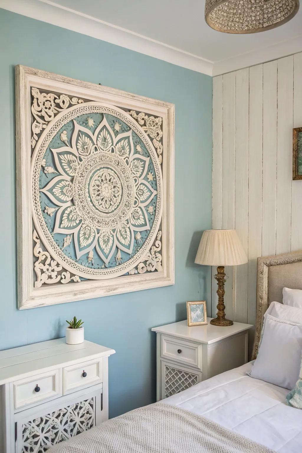 Wall art enhances the aesthetic attraction of a bedroom with a blue and white theme.