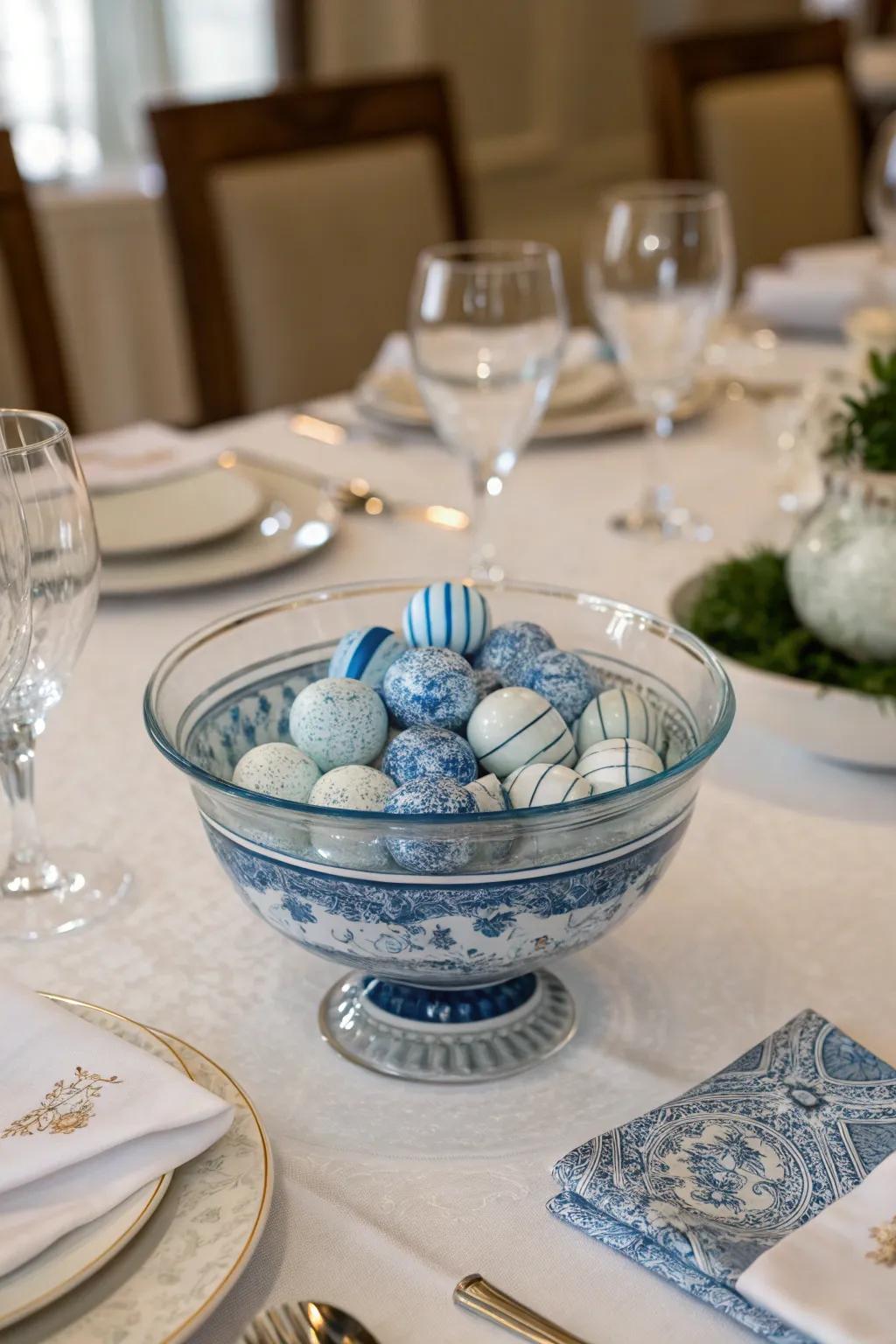 A transparent glass bowl elegantly filled with blue and white porcelain pieces