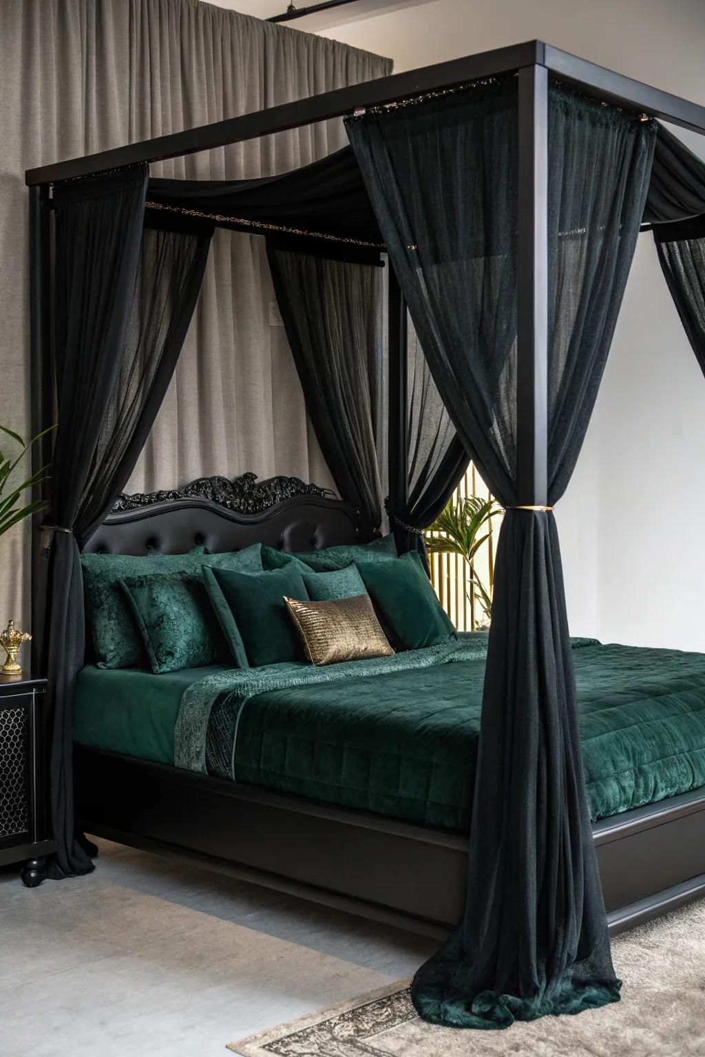 An ebony canopy bed layered with sumptuous green bedding.