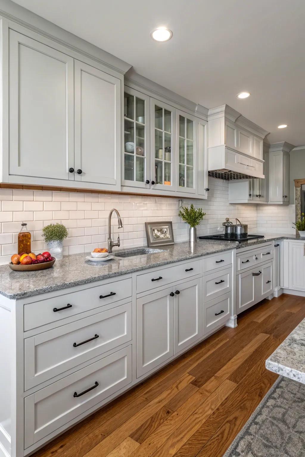 Grey countertops beautifully harmonizing with ivory cabinetry.