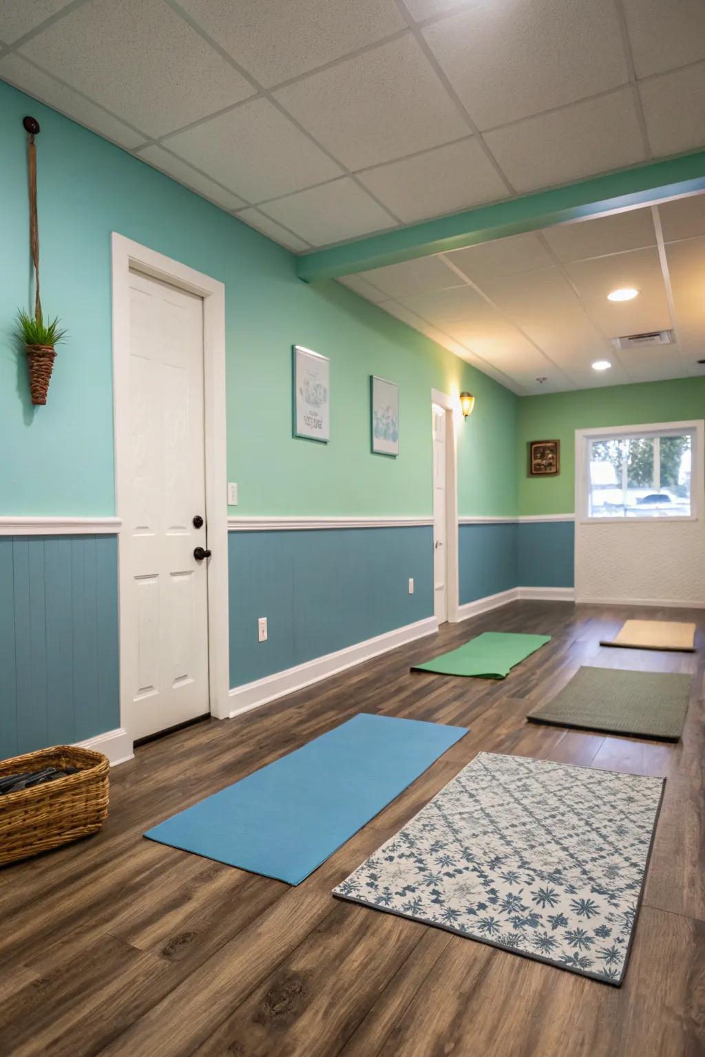 Small yoga room with soothing blue and green painted walls.