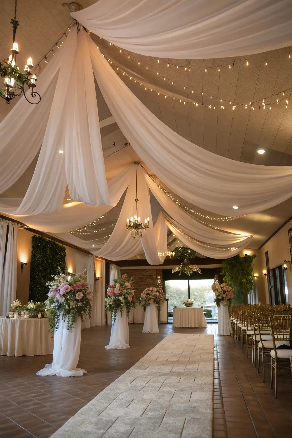A romantic wedding venue adorned with flowing textile on the ceiling.