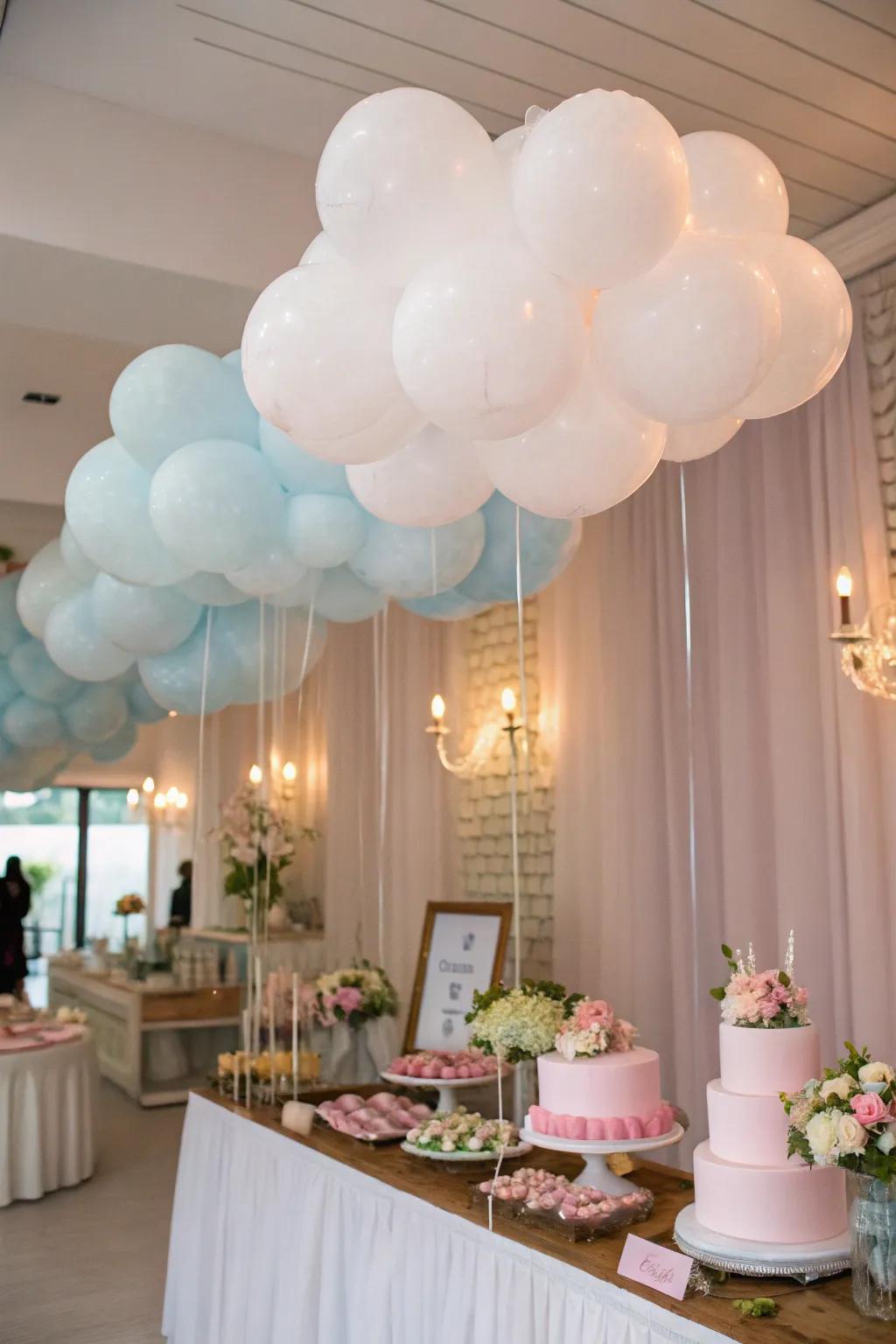 Floating cloud balloons create a dreamy setting above the celebration.