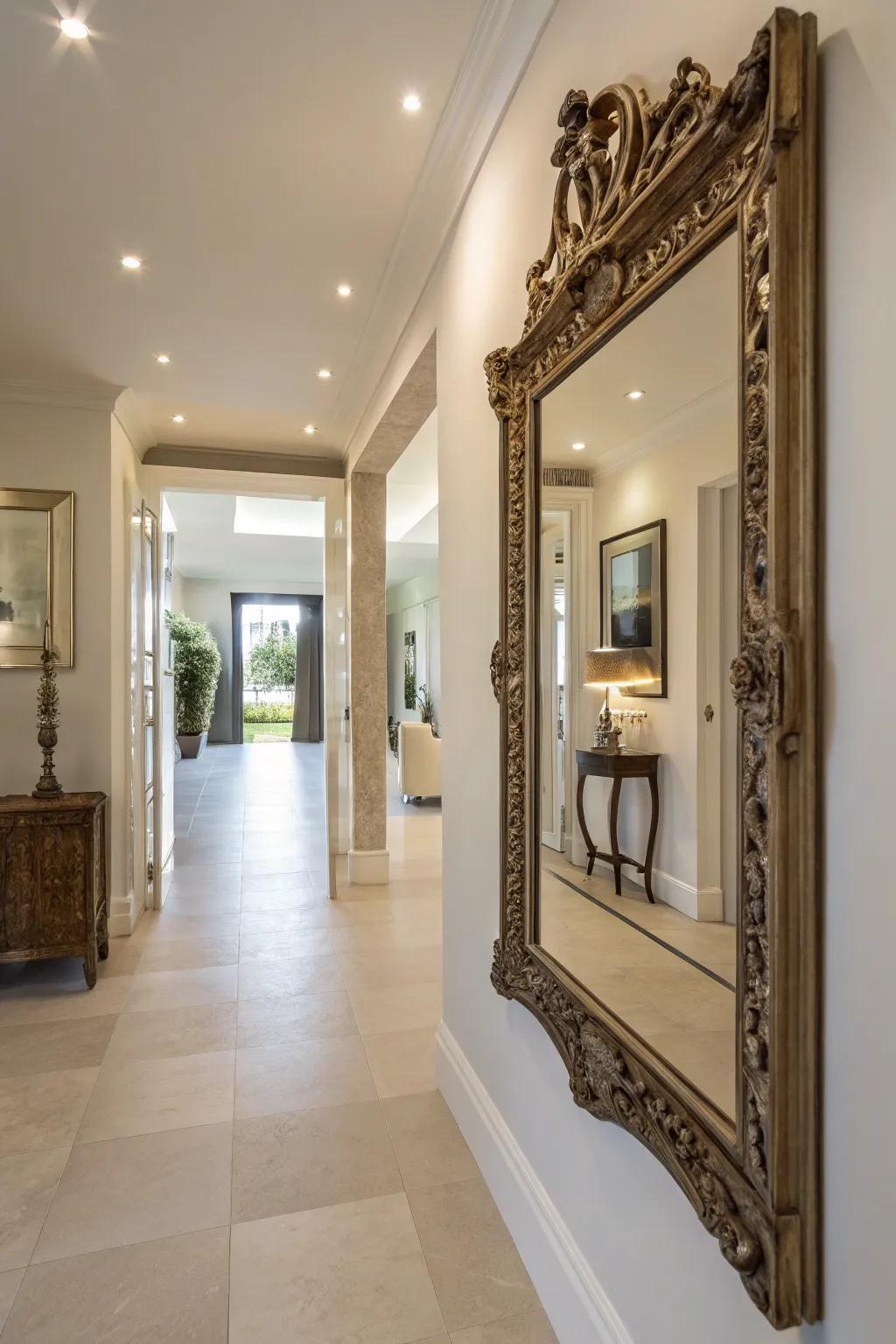 A vintage mirror amplifying light and scale within a corridor.