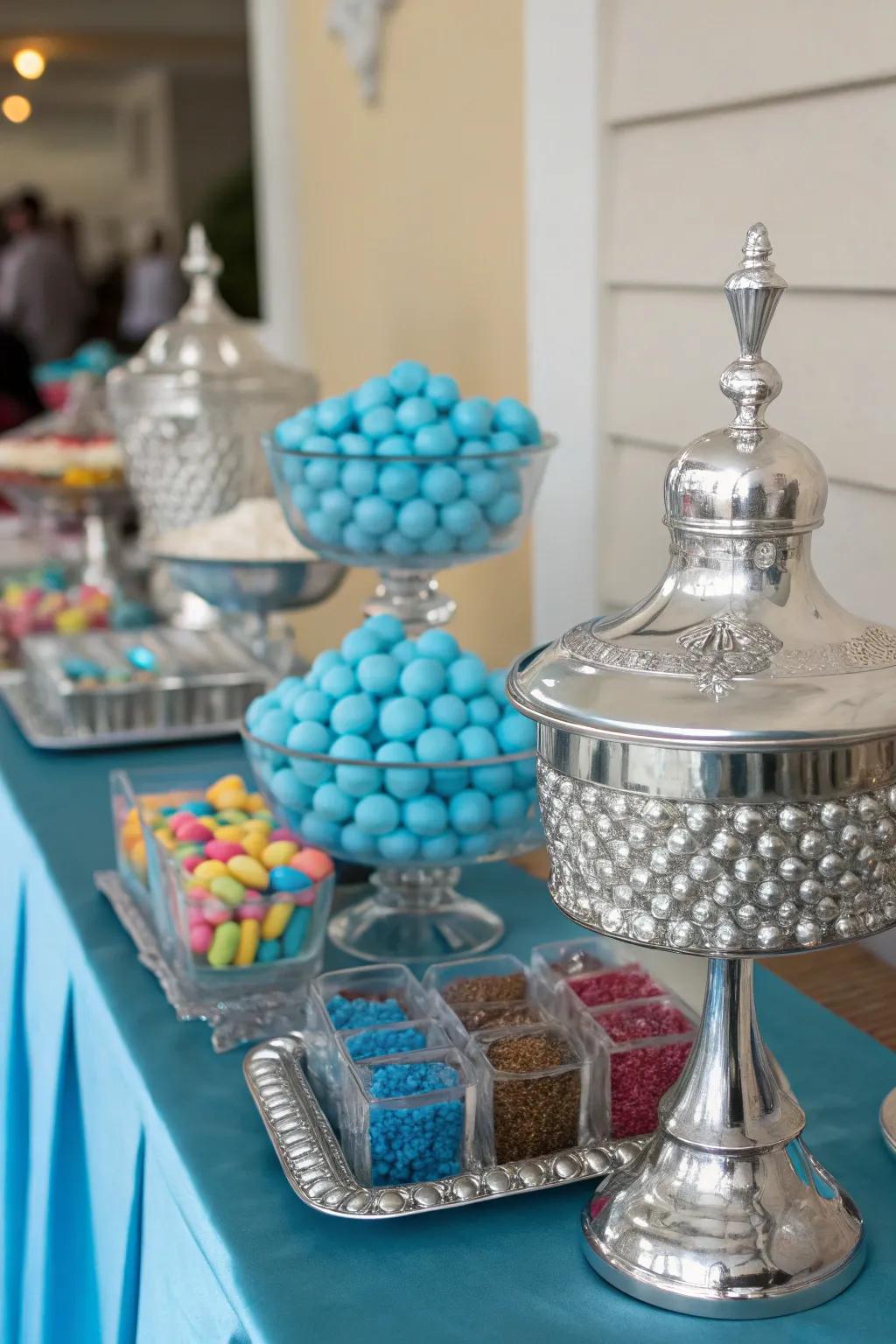 Sophisticated argent accents that enhance the blue sweets display.