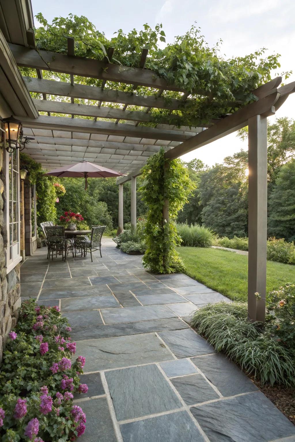 A slate patio enhanced by a wooden pergola.