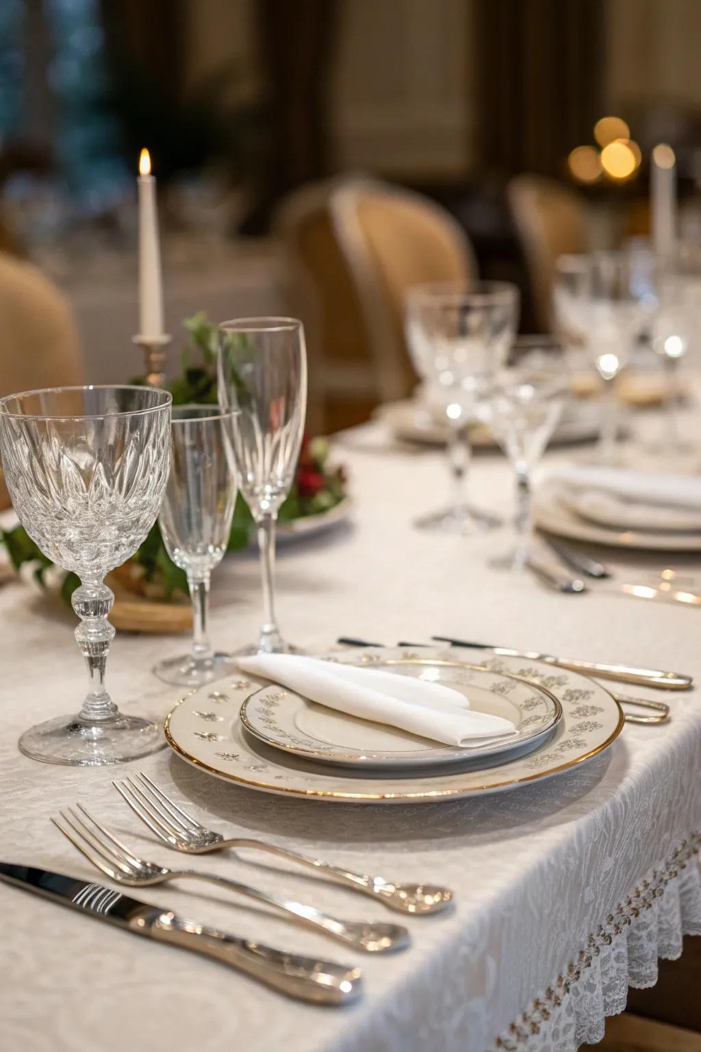 Elegant glassware and implements impart opulence to the table arrangement.