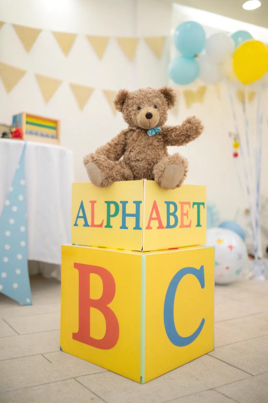 A playful centerpiece featuring a stuffed bear on a letter block.