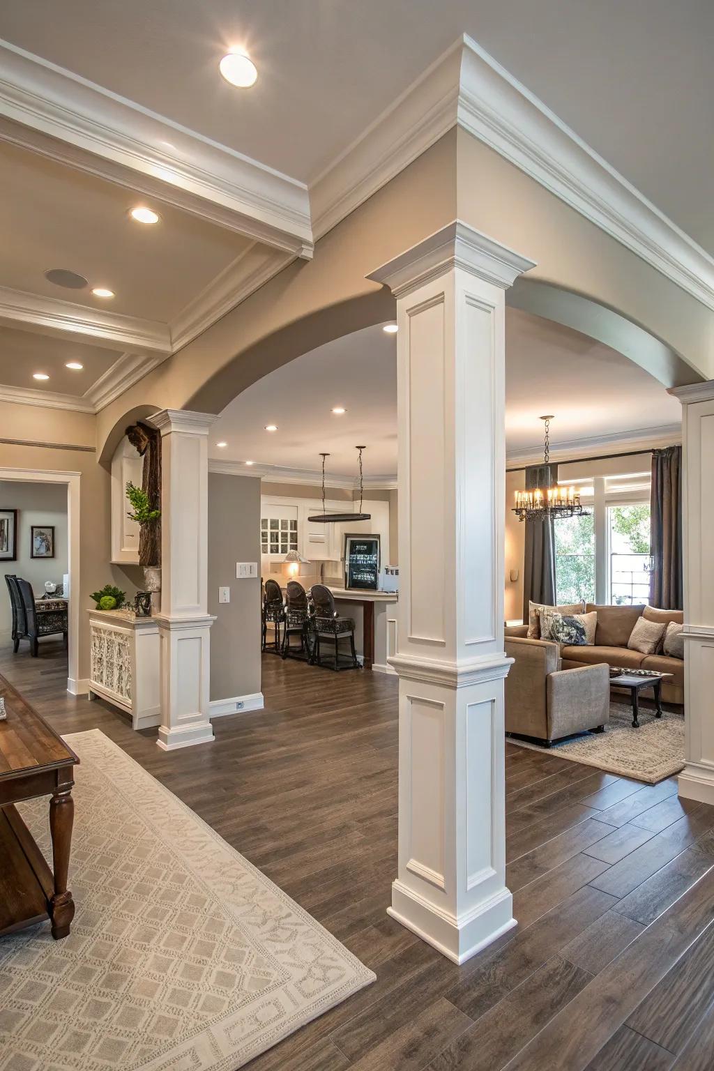 An open-concept living expanse, embellished with expansive crown molding, thereby imparting an enhanced sense of grandeur and coherence.