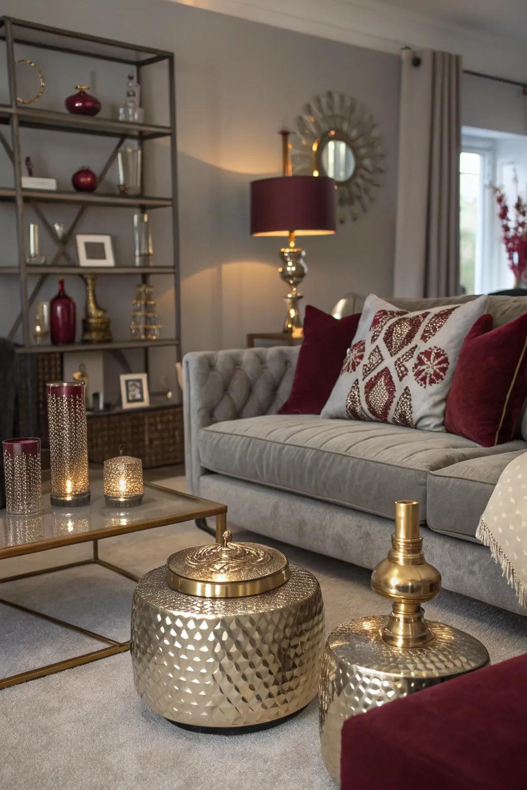 A living room showcasing metallic accents within a grey and burgundy color scheme.